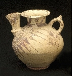 Decorated jar with a handle and a spout