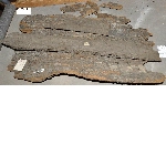 Remains of planks of a wooden coffin
