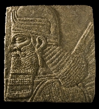 Assyrian bas-relief with the head of a genie