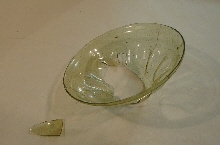 Fragment of a glass beaker with cavities