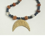 Necklace with beads and crescent shaped pendant