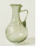 Small greenish glass flask with handle