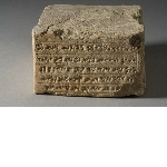 Fragment of a brick with inscription