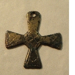 Cross with one arm pierced for suspension of the object