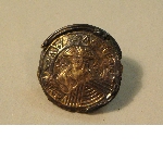 Coin-shaped fibula